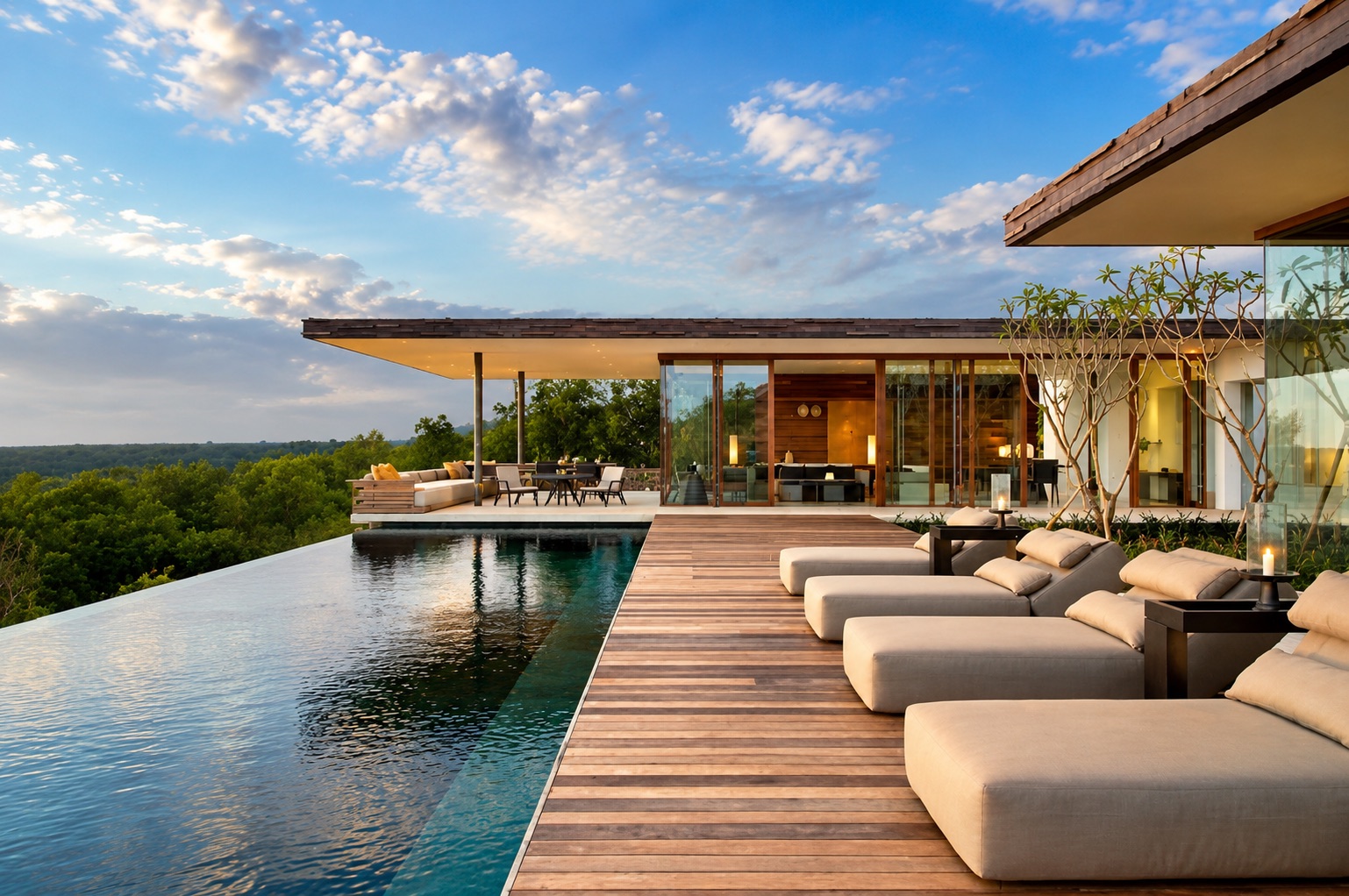 Laluna Ville — the infinity pool and lounge deck at dusk, overlooking the landscape