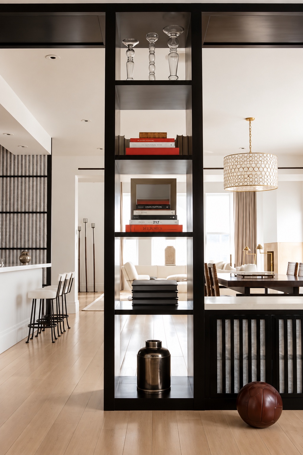 Tribeca Loft — dark open shelving dividing the living and dining areas